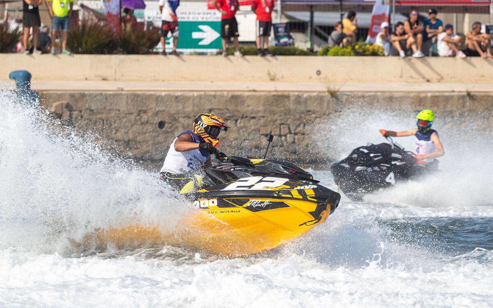 Two aquabikes racing with water spraying