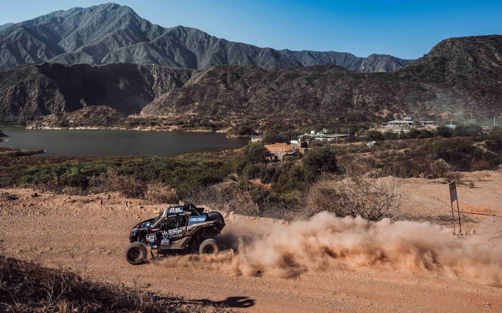 A rally car sprays up sand in Argentina