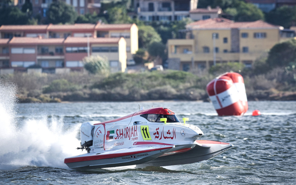 Boat racing across water