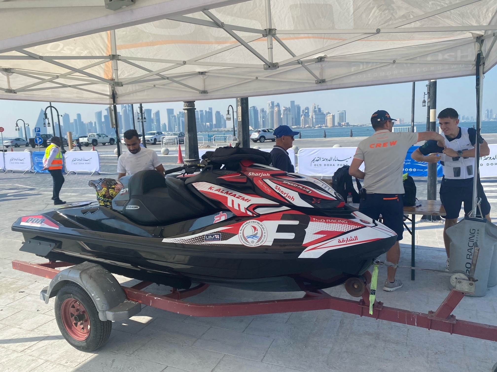 Technical scrutineerring with the backdrop of West Bay in Doha.